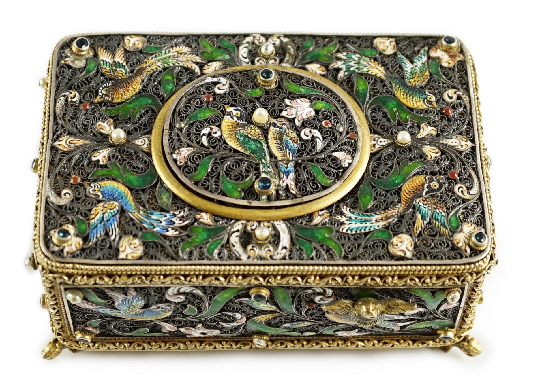 A 19th century Austro-Hungarian 800 standard silver gilt, jewelled and enamelled rectangular singing bird box automaton